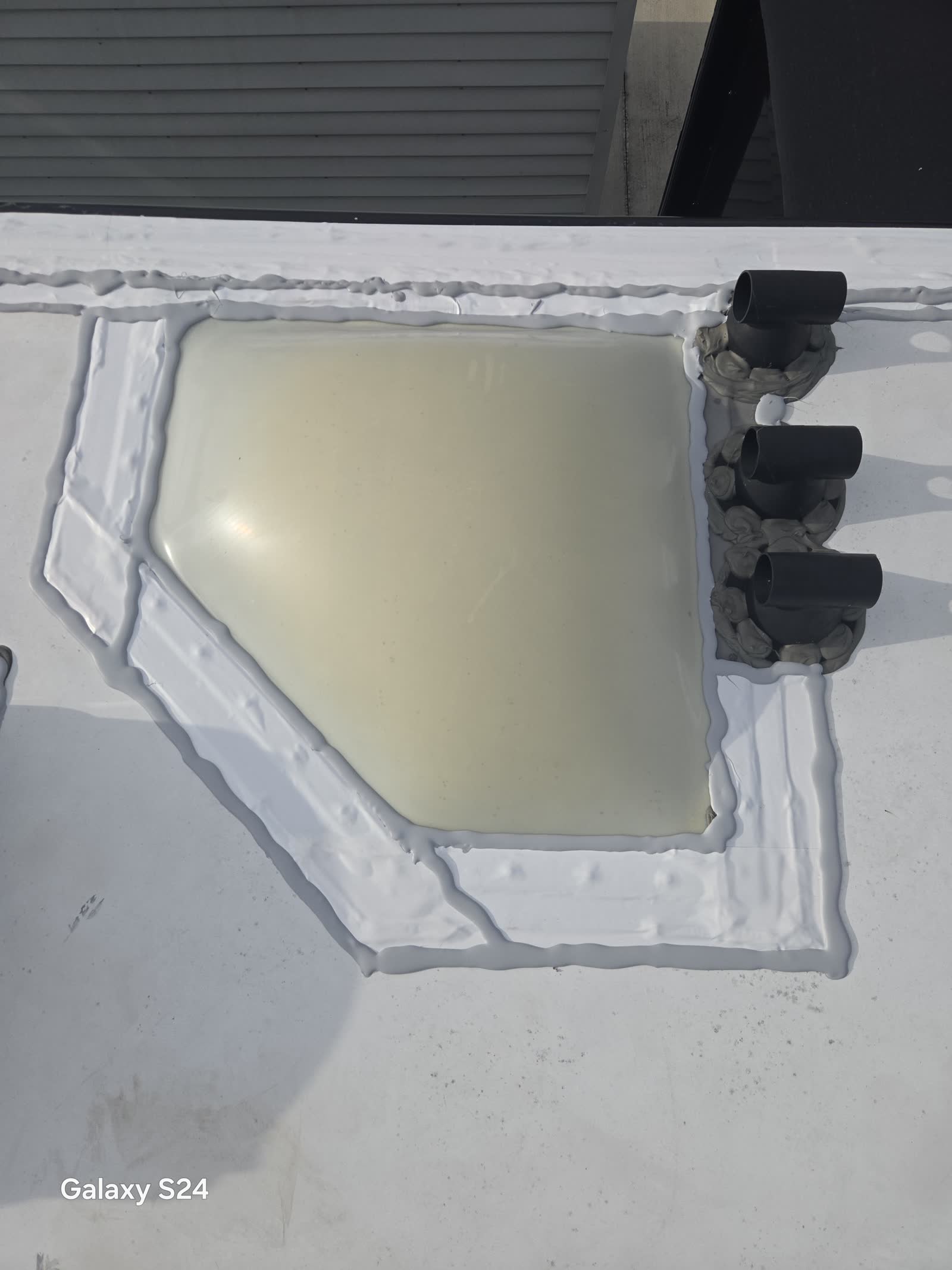 Fresh roof sealant applied around an RV roof vent by Rudy's RV Repair in Sarasota, Florida
