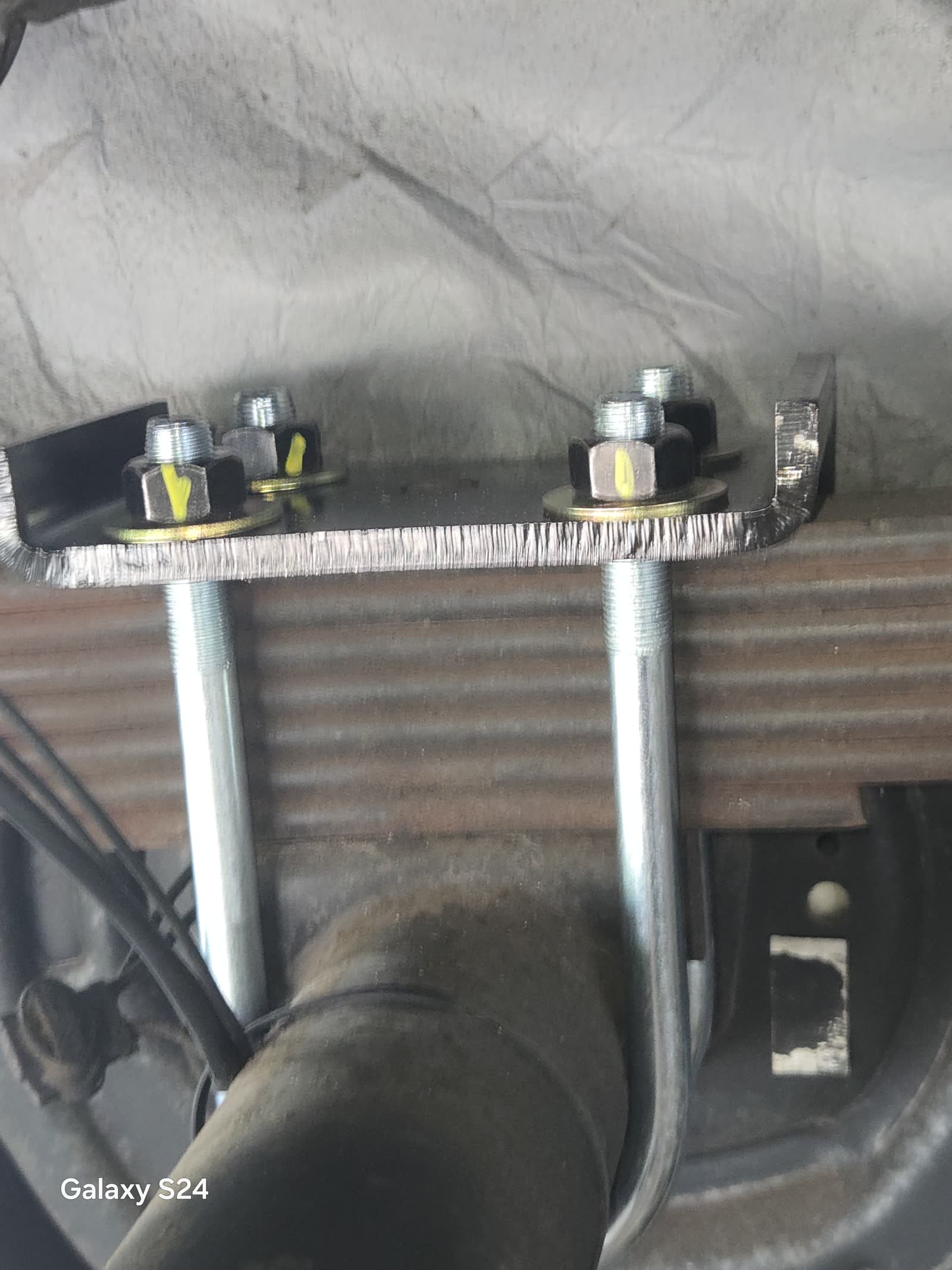 RV undercarriage bolts and hardware secured during repair by Rudy's RV Repair in Sarasota, Florida