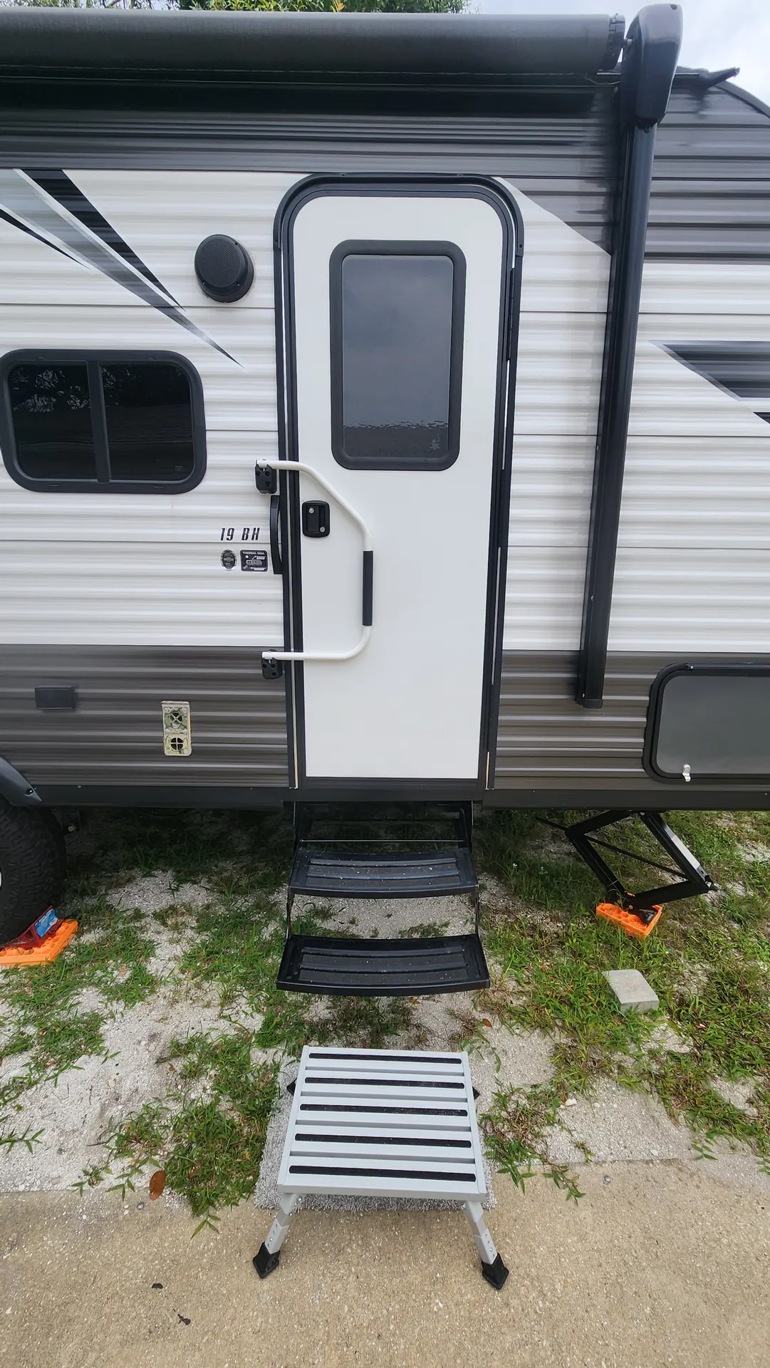 Travel trailer entry door with repaired fold-out steps in Venice, Florida